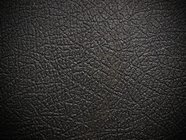 Glänsande svart läder bakgrund på nära håll — Stockfoto