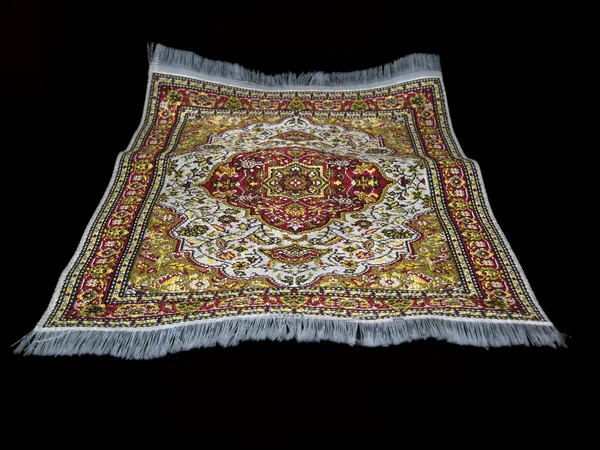 Flynig turkish carpet on black — Stock Photo, Image