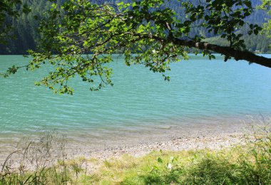 Lake and mountains in the Alps clipart