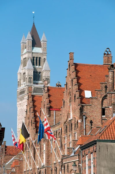 Notre dame Belfry and flags at Brugge - Belgium — Stock Photo, Image