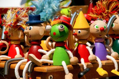 Handmade colorfull wooden puppets clipart