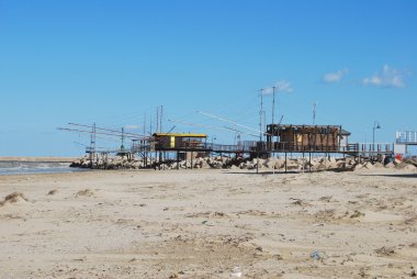 The beach and the fishinghouse in Pescara clipart