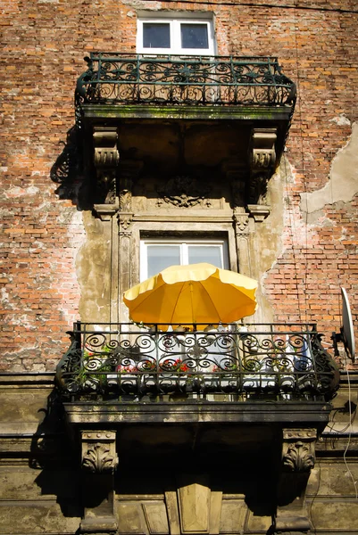 A window with yellow umbrella in krakow, poland, europe — Stock Photo, Image