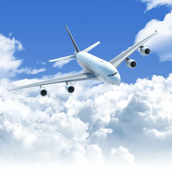 Letadlo letící nad mraky přední horní pohled — Stock fotografie