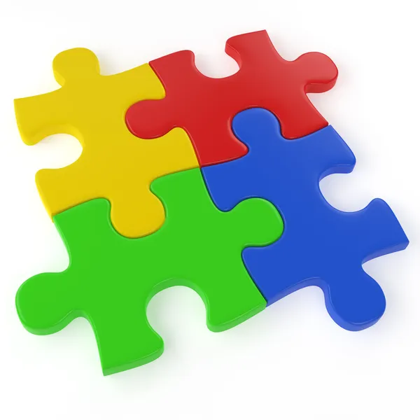 Vier kleur puzzelstukjes — Stockfoto