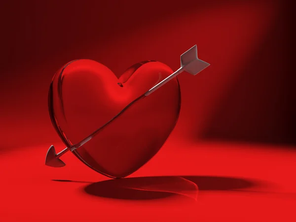 Glass heart and cupid arrow on red — Stock Photo, Image