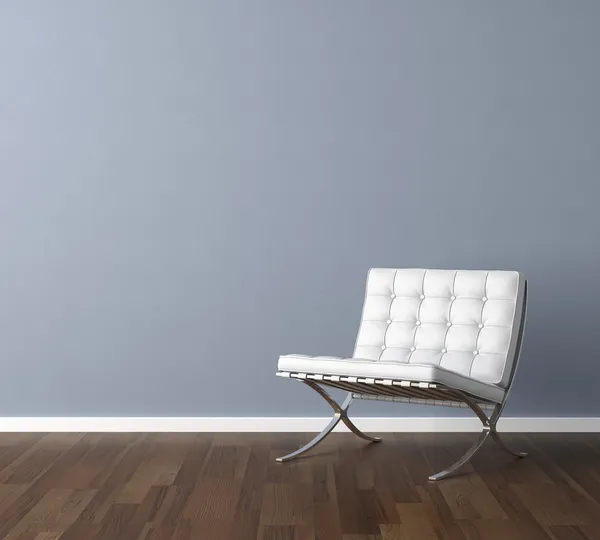 Синя стіна з дизайном інтер'єру білого стільця Стокове Фото
