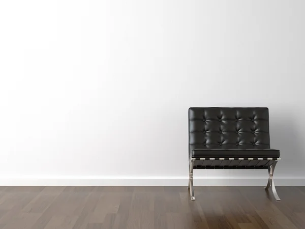 Черный стул на белой стене — стоковое фото
