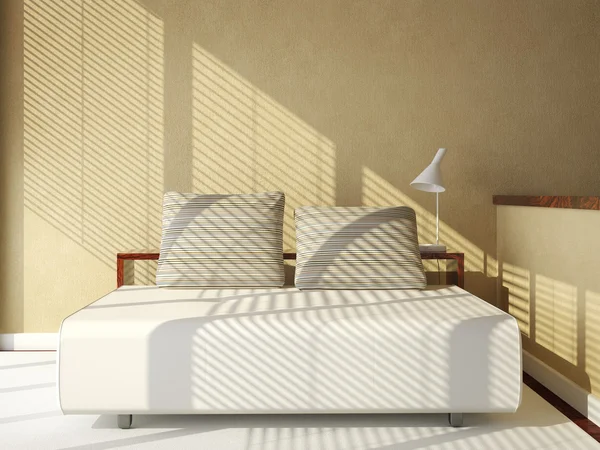 Sofa-bed on tan wall — Stock Photo, Image