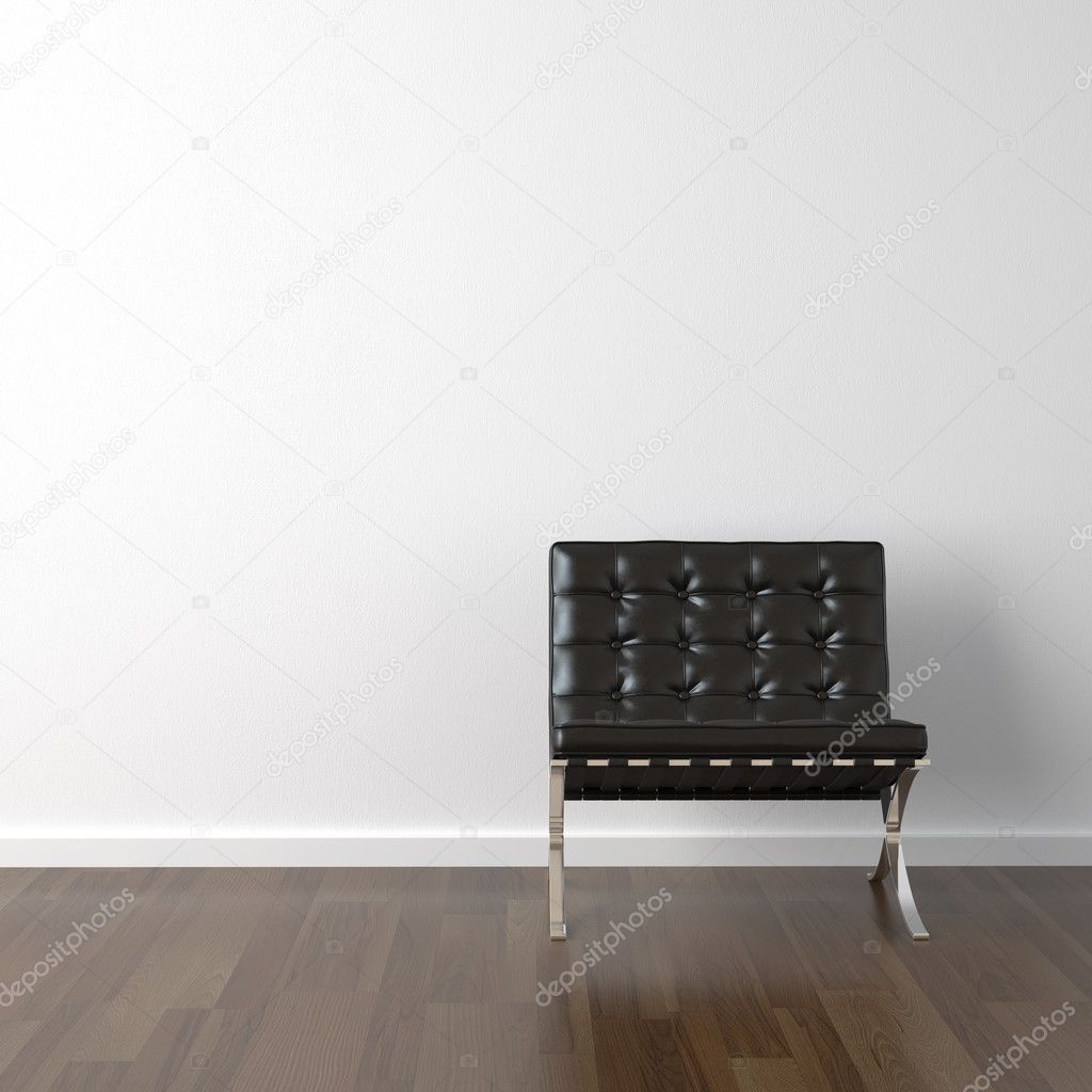 Black leather chair on white wall