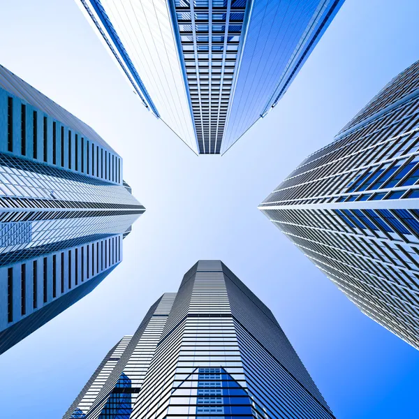 Blue highrise glass skyscraper intersection low angle shot — Stock Photo, Image