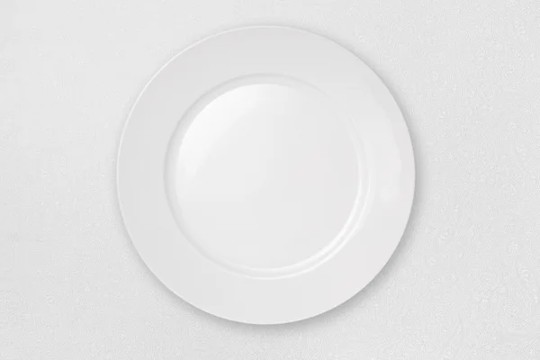 Άδειο πιάτο στο λευκό τραπεζομάντιλο με διαδρομή αποκοπής — Φωτογραφία Αρχείου