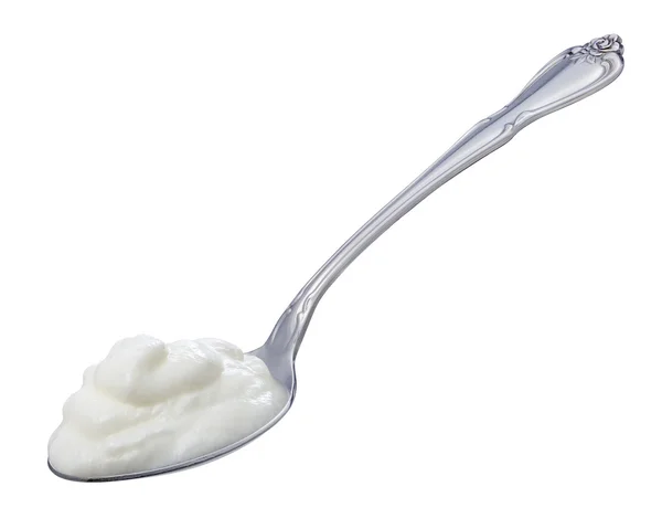 Ложка йогурту ізольована відсічним контуром — стокове фото