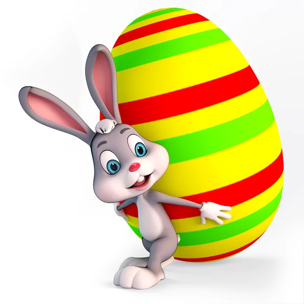 Easter bunny with heavy colorfulegg — Stock Photo, Image