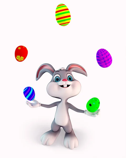 Easter bunny balancing the eggs — Stock Photo, Image