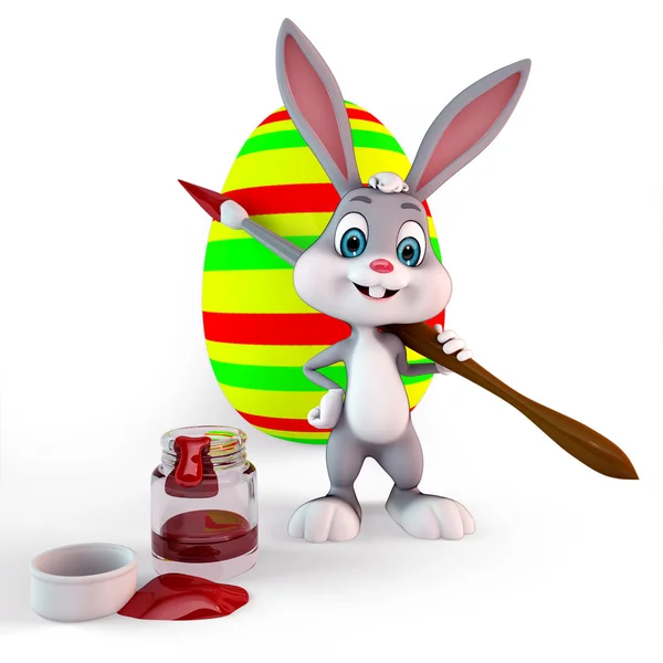 Easter bunny with a colorful egg and paint brush — Stock Photo, Image