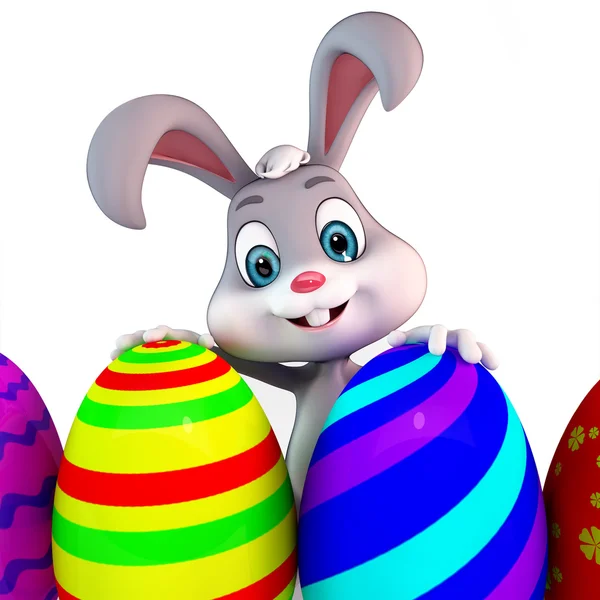 Šťastný bunny s barevnými vejci — Stock fotografie