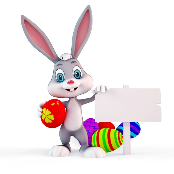 Happy Bunny with sign and colorful eggs — Stock Photo, Image
