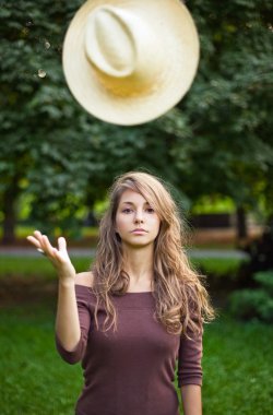 Beautilful young brunette posing outdoors. clipart