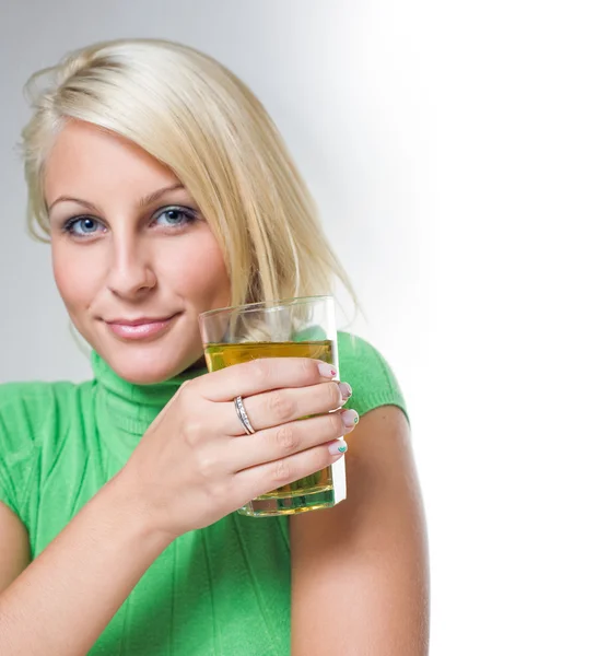 stock image Gorgeous young blond with glass of juice.