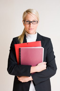 Tense looking young business woman. clipart