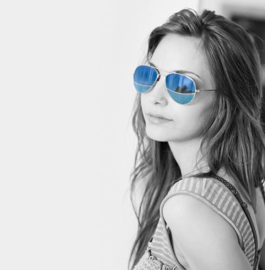 Grunge styled portrait of gorgoeus young brunette in sunglasses. clipart