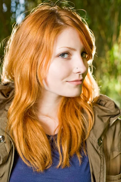 Beautiful young redhead girl outdoors. — Stock Photo, Image
