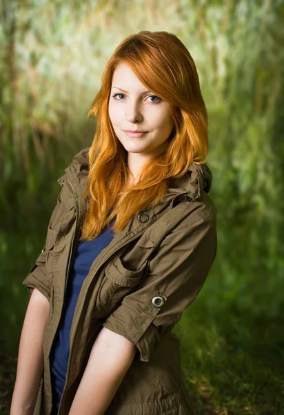 Beautiful young redhead girl outdoors. — Stock Photo, Image