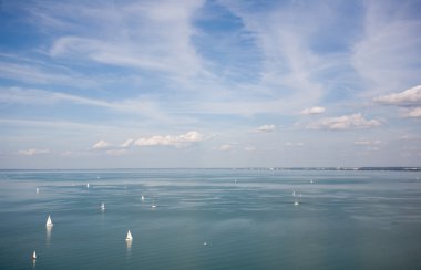 Sail boats on the horizon. clipart