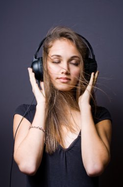 Immersed in music. clipart