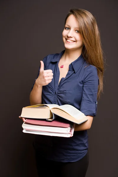 Estudante bonito mostrando polegares para cima . — Fotografia de Stock