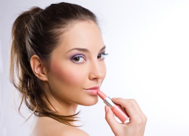 Sensual young woman with pink lipstick clipart