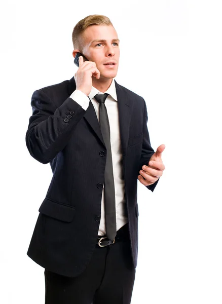 Framgångsrik ung affärsman på hans mobiltelefon. — Stockfoto