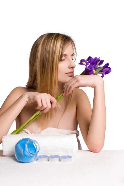 Blond spa girl with iris flowers. — Stock Photo, Image