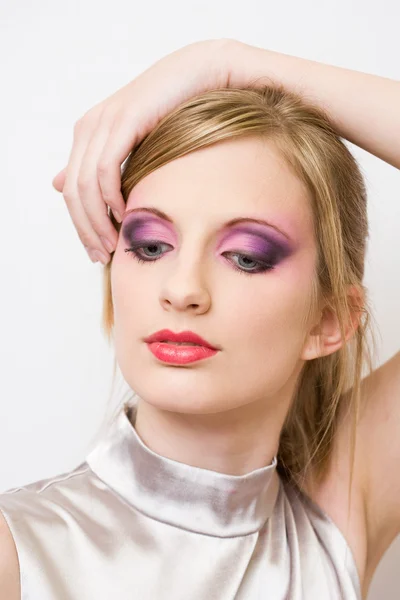 Retro styled young blond in colorful makeup. — Stock Photo, Image