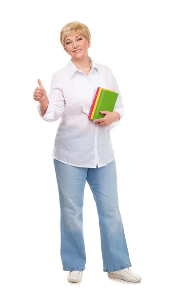 Senior woman holding books and showing OK — Stock Photo, Image