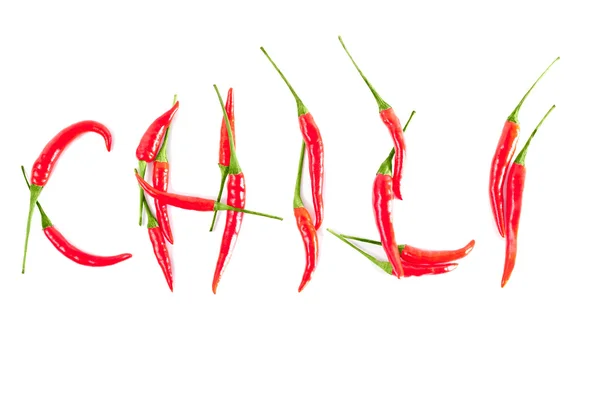 Red peppers in a word CHILI — Stock Photo, Image