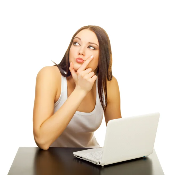 The young woman with the laptop behind a table — Stock Photo, Image