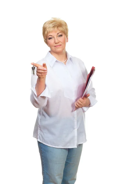 Portrait of a smiling adult woman with folder and key — Stock Photo, Image