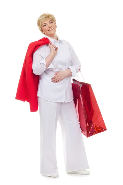 Portrait of a smiling adult woman with shopping bags — Stock Photo, Image