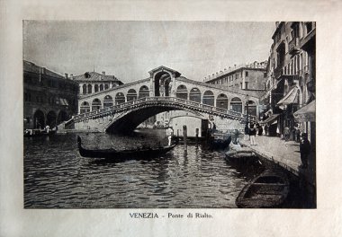 ITALY - CIRCA 1910: A picture printed in Italy shows image of Venice view Ponte di Rialto with gondola boat, Vintage postcards 