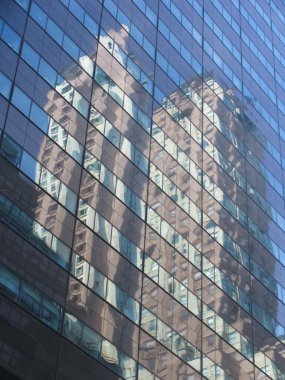 Skyscraper mirrors in another skyscraper clipart