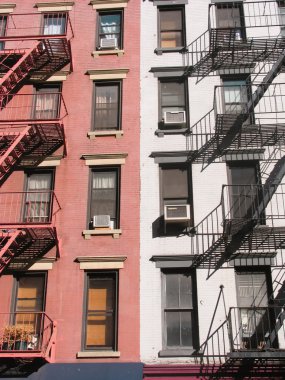 Red and white wall with windows and fire escape clipart