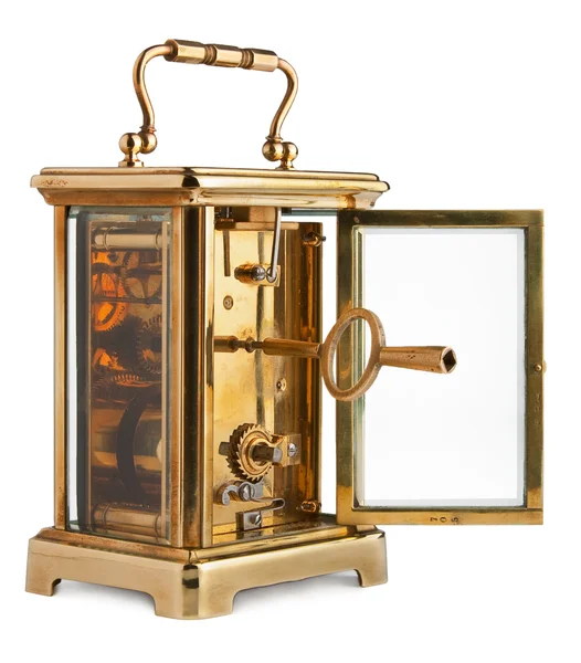 Антикварные часы с открытой задней дверью, показывающие ключ — стоковое фото