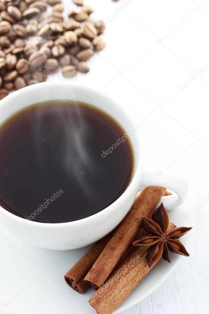 Cup of Hot Coffee with Cinnamon Sticks, Star Anise and Coffee Beans