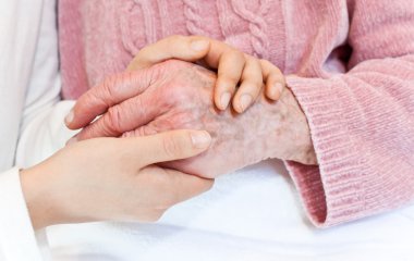 Young holding senior's hand clipart