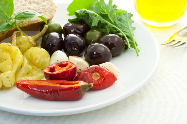 Pickled peppers and olives — Stock Photo, Image