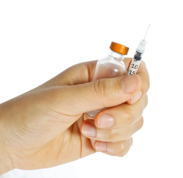 Hand holding a syringe and vial — Stock Photo, Image