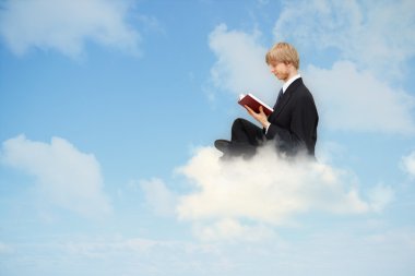 Reading book on the cloud clipart