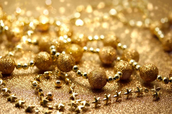 Christmas golden beads Royalty Free Stock Images